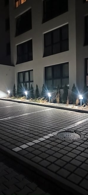 A paved area with a building in the background.