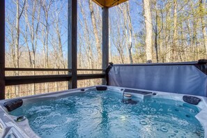 A hot tub with a view of leafless trees. - Sassy Bear Hideaway by Beyond Expectations (Sevierville)