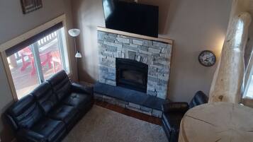 Smart TV, fireplace, table football, books