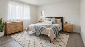 A bedroom with a bed, bedside tables, a dresser, a potted plant, and a window with sheer curtains. - Private Room in SE Austin - 10 min from Airport & Downtown (Austin)