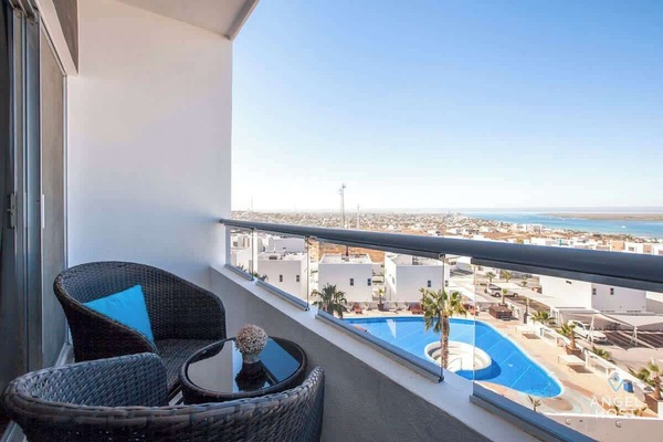You'll have beautiful bay & ocean views & a glimpse of one of the pools below too!