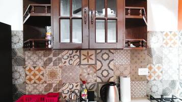 Fridge, microwave, stovetop, coffee/tea maker