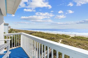 A balcony with a view of the beach and ocean. - Totally Beachin' - Oceanfront, King bed, Pool (North Myrtle Beach)