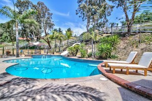 A swimming pool with lounge chairs, surrounded by trees and a white fence. - Rancho Vista Estate on 3 acre, Private grapevines (Temecula)