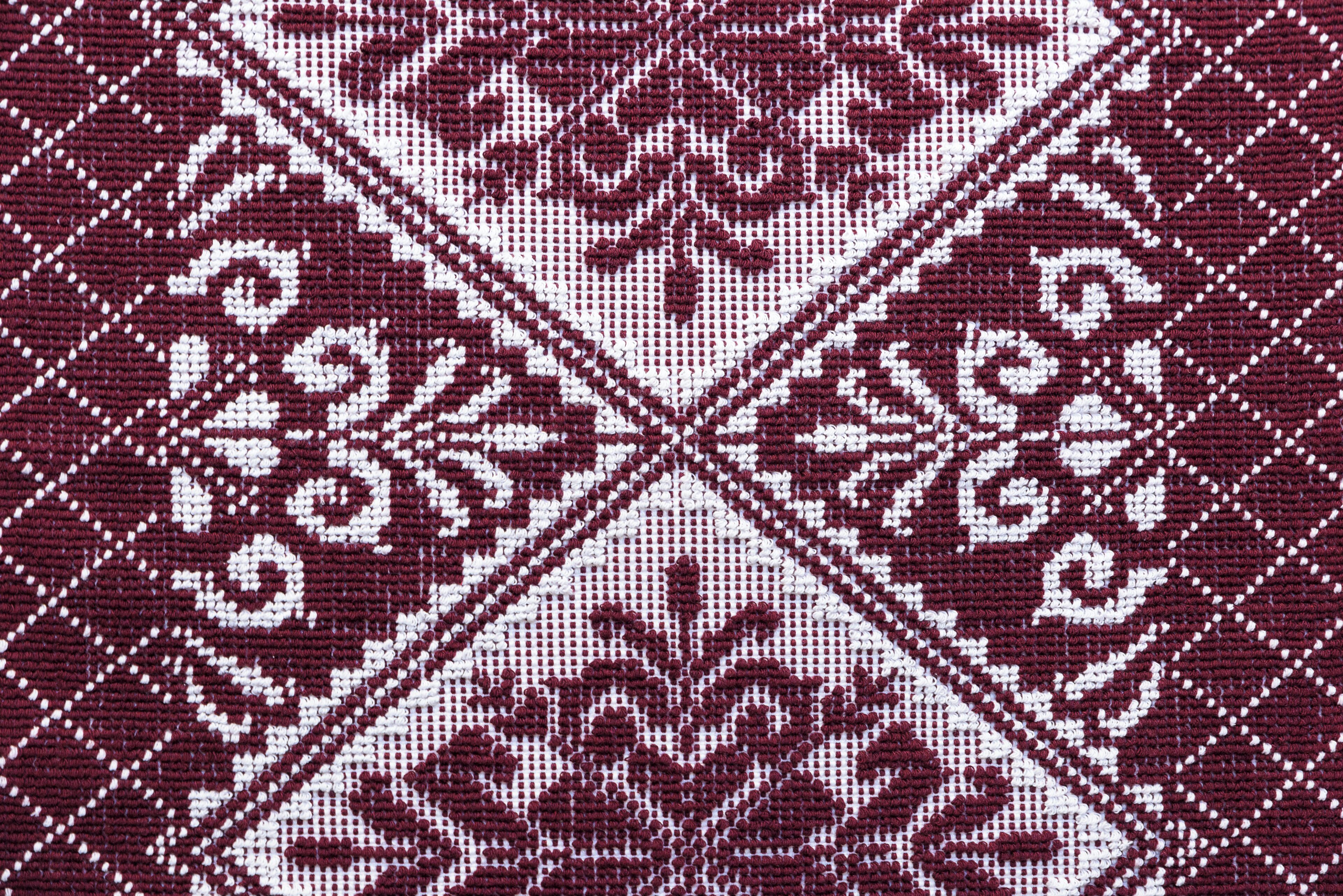 A close-up of a patterned fabric with a symmetrical design.