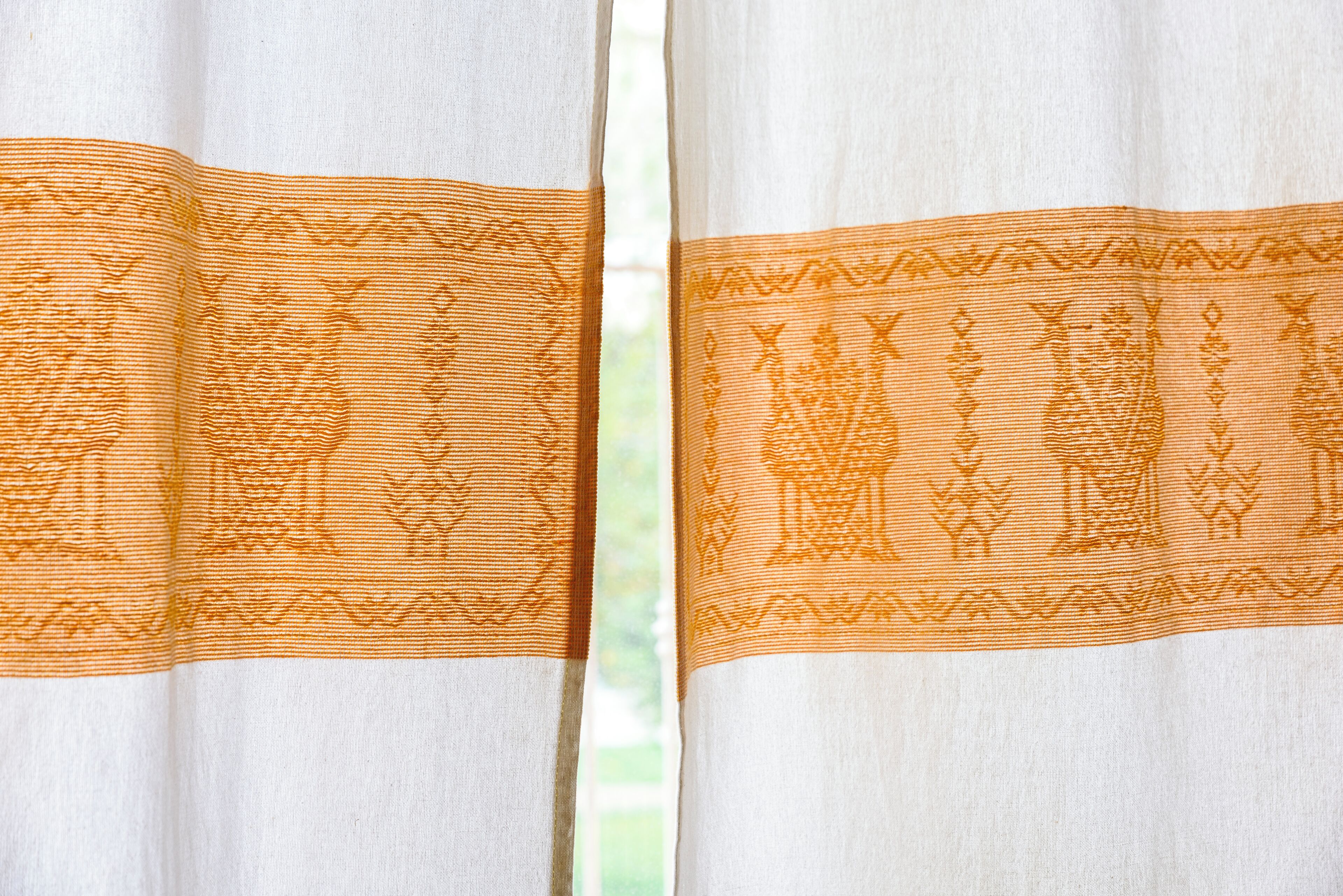 A curtain with a patterned design.