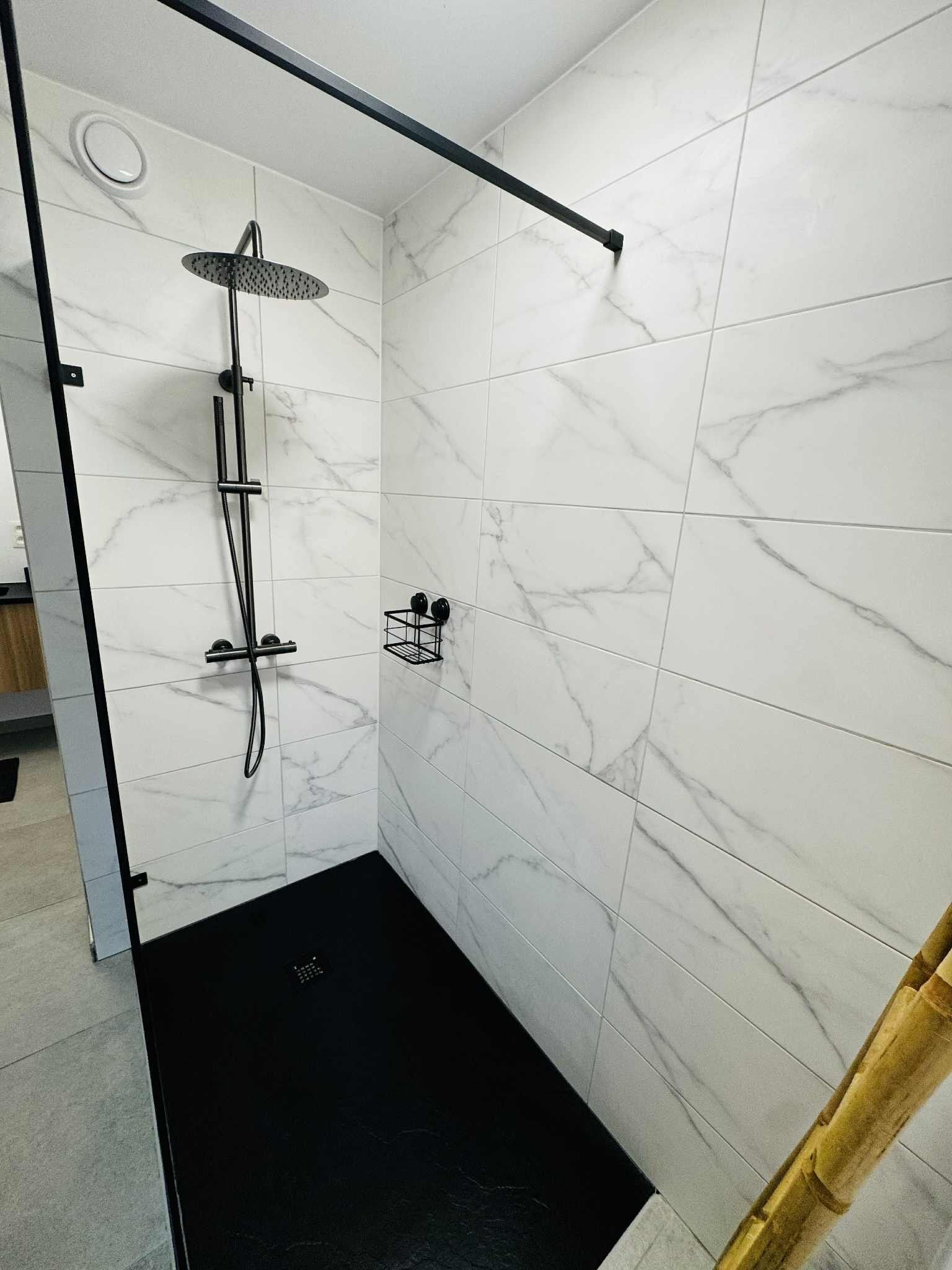 Shower, hair dryer, towels, toilet paper