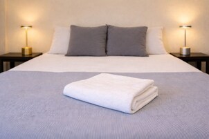 Down comforters, laptop workspace, bed sheets