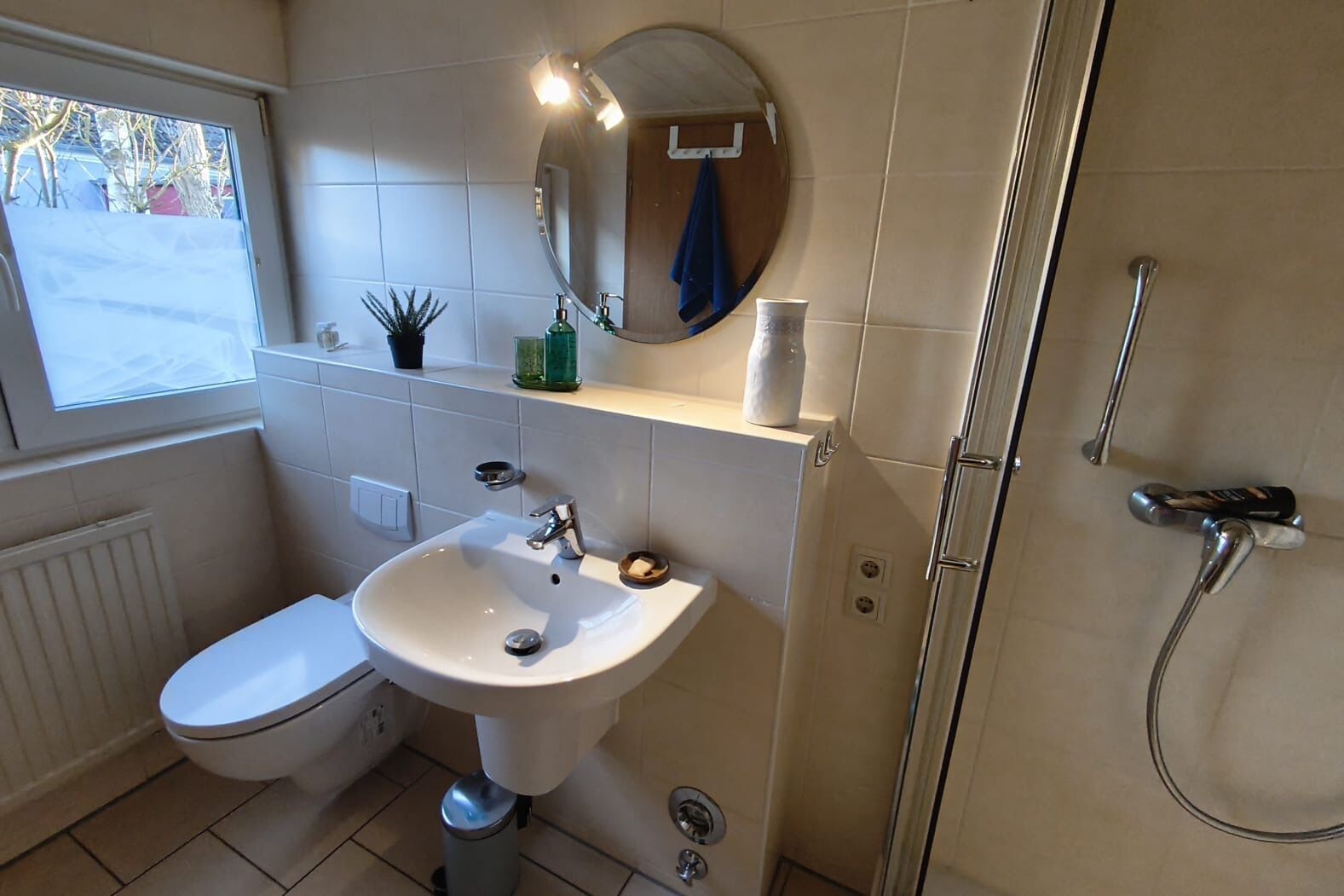 Shower, hair dryer, towels, toilet paper