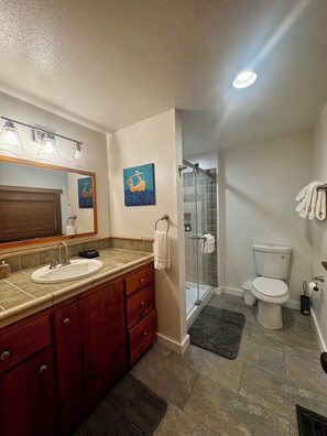 A bathroom with a vanity, sink, mirror, and a shower. - Wine Country Ranch Retreat on a Working Horse Ranch (Santa Ynez)