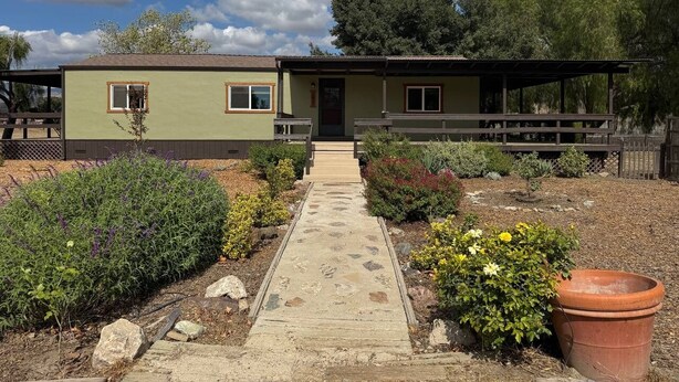 A two-story house with a paved walkway leading to the entrance. - Ranch Retreat in Wine Country - Horses & Views! (Santa Ynez)