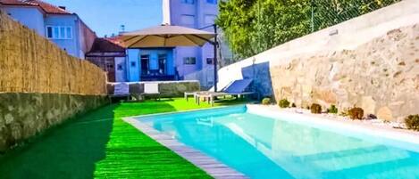 Seasonal outdoor pool, open 9:00 AM to 8:00 PM, pool umbrellas