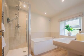Shower, hair dryer, towels, shampoo