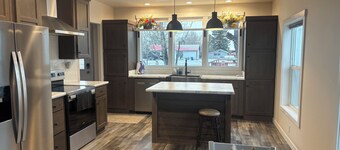 New and comfortable home with open floor plan and electric fireplace.