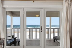 A covered deck with a view of the beach and ocean. - Stunning Oceanfront, newly renovated! (Old Orchard Beach)