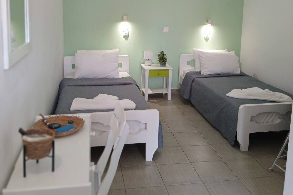 Basic Twin Room | Iron/ironing board, WiFi (free), bed sheets