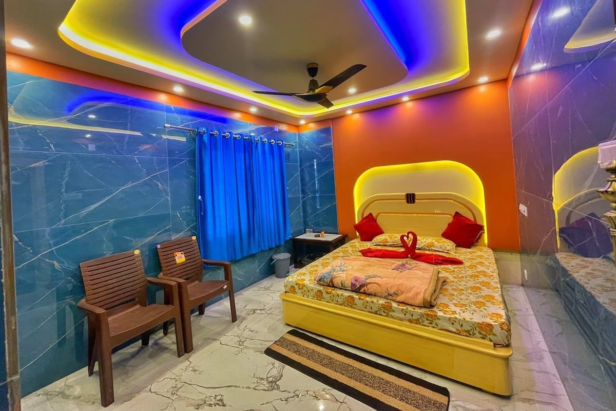 A modern bedroom with a bed, a desk, and a chair.