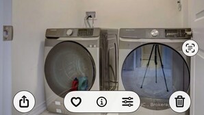 A laundry room with two front-loading washing machines and a dryer. - Spacious and well furnished bedroom in a new built in Oshawa, Ontario. Canada. (Oshawa)