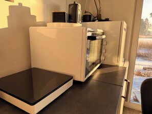 A kitchen with a built-in oven and a countertop.