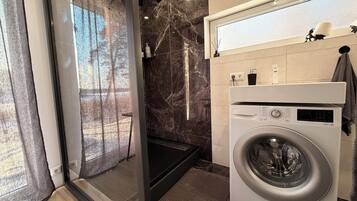 Shower, hair dryer, towels, soap