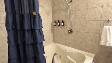 Shower, jetted tub, hair dryer, towels