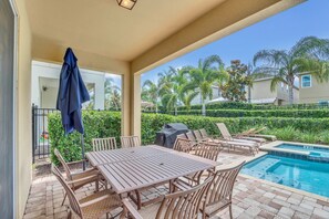 Outdoor dining - 8BR Superb Villa, Pool, Spa • Near Disney (Kissimmee)
