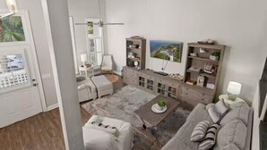 A modern living room with a sofa, armchair, and coffee table. There is a bookshelf, a lamp, and a painting on the wall. - Large beach home w golf cart, minutes from beach! (St Simons Island)