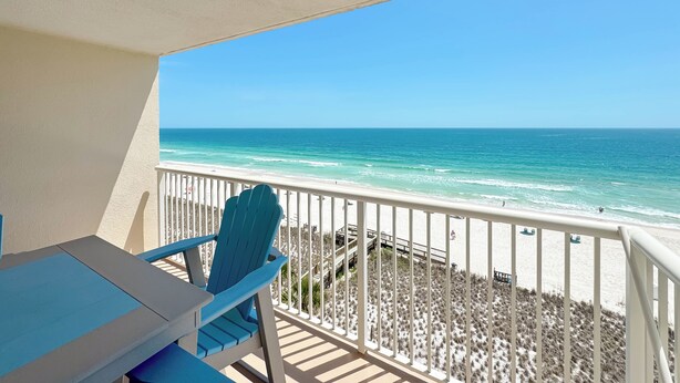A balcony with a view of the beach and ocean. - Sandy Key 732 | Spacious Beachfront Condo | Pools, Hot Tub & Tennis | My Beach Getaways (Pensacola)