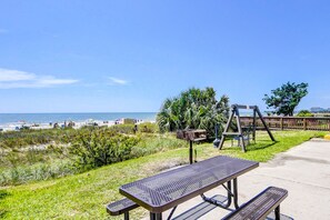 Outdoor dining - Oceanfront condo with pool, hot tub, lazy river - direct beach access (Myrtle Beach)