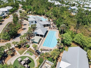 An aerial view of a resort with a swimming pool, multiple buildings, and lush landscaping. - Community Pool, Sleeps 10, Sunrise & Serenity, Bikes (Seagrove Beach)