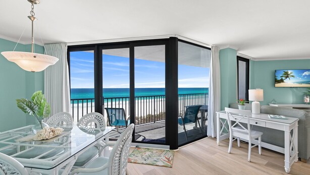 A room with a glass door leading to a balcony with a view of the ocean. - New Listing!   Fall Specials & Free Beach Chair Service ~ 3rd Floor (Panama City Beach)