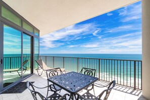 Outdoor dining - Gulf-Front Condo at Oasis, Private Balcony, Sleeps 10, Monthly Rates (Orange Beach)