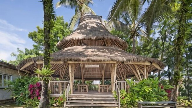 A thatched-roof pavilion with a wooden bench and a small table, surrounded by lush greenery and palm trees. - Asep Gumi Bamboo Villa Pesagi (Bali)