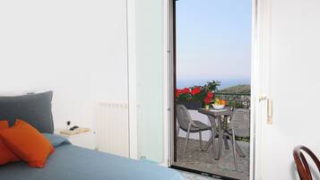Panoramic Apartment, Sea View | Desk, laptop workspace, blackout drapes, iron/ironing board