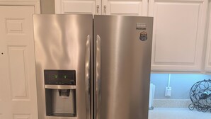 A stainless steel refrigerator with a water dispenser, built-in ice maker, and a freezer drawer. - Welcome to Coastal Retreat 
at Palo Alto! (The Villages)