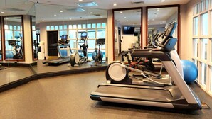 A gym with exercise equipment, mirrors, and large windows. - BC Lodge King Suite | Fireplace | Village Location (Beaver Creek)