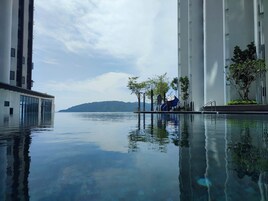 Outdoor pool, open 7:00 AM to 10:00 PM, pool umbrellas, sun loungers