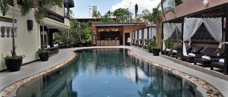 Outdoor pool, open 9:00 AM to 9:00 PM, pool loungers