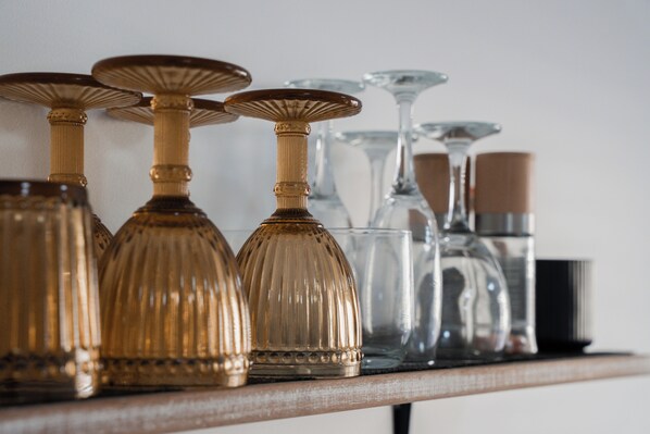 A collection of glassware on a shelf. - The Whitehouse Denham (Denham)