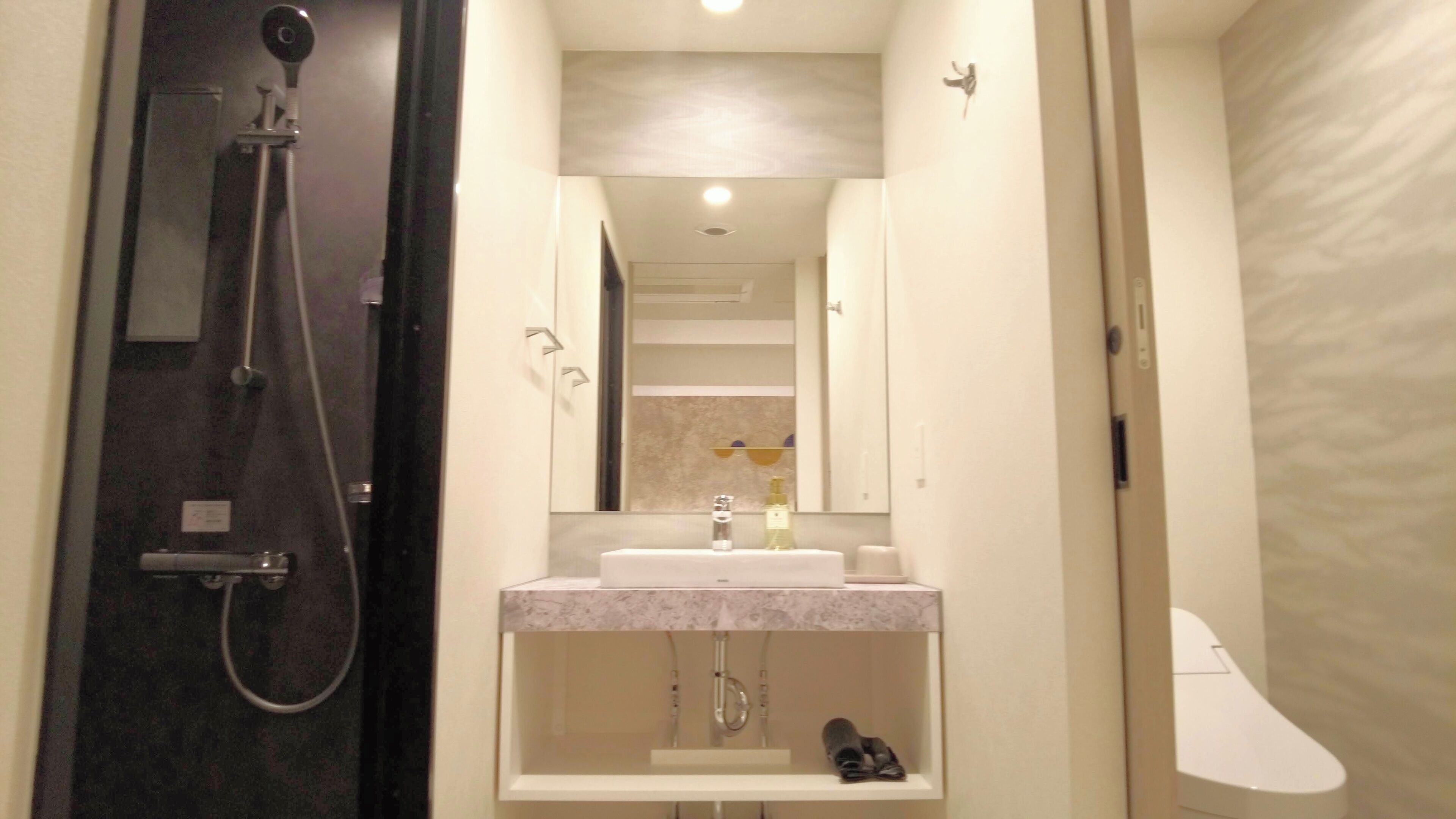 Hair dryer, slippers, towels, shampoo