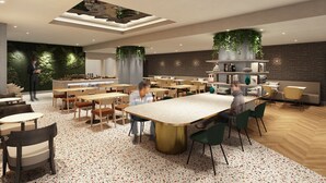 A modern restaurant with a central dining table, multiple seating areas, and a decorative ceiling. - HOTEL AMANEK Kumamoto (Kumamoto)
