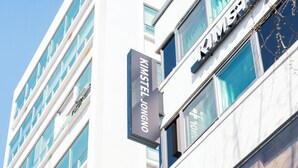 A building with a sign reading 'KIMSTEL JONGNO' and multiple windows. - KIMSTEL Jongno (Seoul)