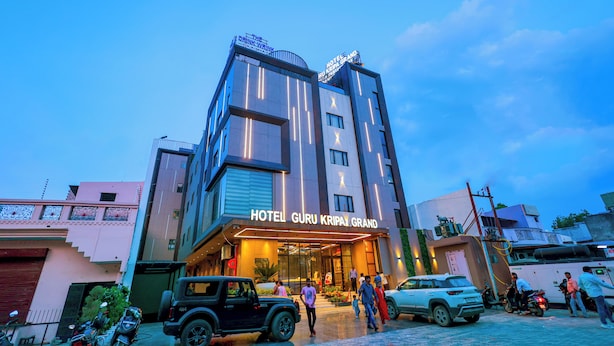 A multi-story hotel with a prominent sign reading 'HOTEL GURU KRIPAY GRAND.' - Hotel Guru Kripa Grand (3-Star Category)  (Mathura)