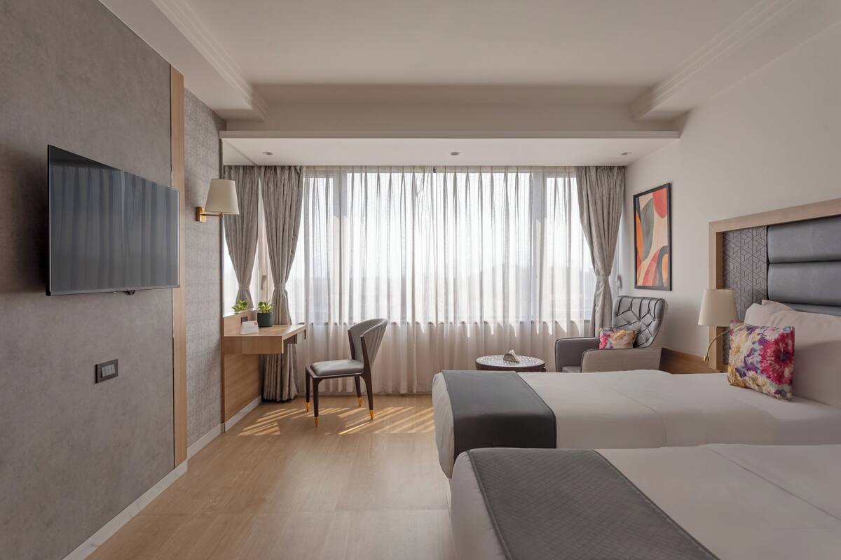 Quarto executivo, sacada, vista para a cidade