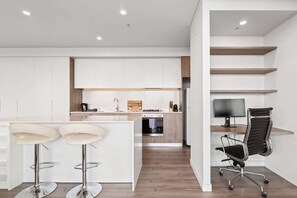 Fridge, microwave, oven, stovetop - Luxe 2-Bed: Modern Interiors, Balcony & BBQ Area (Lidcombe)