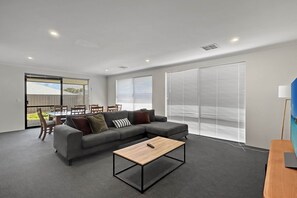 Living area - Spacious 4-Bed House with Large Backyard (Karnup)