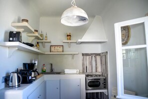Fridge, coffee/tea maker, cookware/dishes/utensils, dining tables - Sunset Horizon Villa with Hot Tub and Sea & Sunset View (Thira - Santorini)