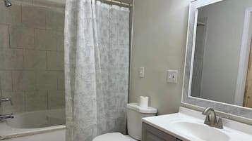 Jetted tub, towels, toilet paper