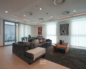 Deluxe Apartment, Balcony, Ocean View | Living area - Short Stays By CW (Lagos)