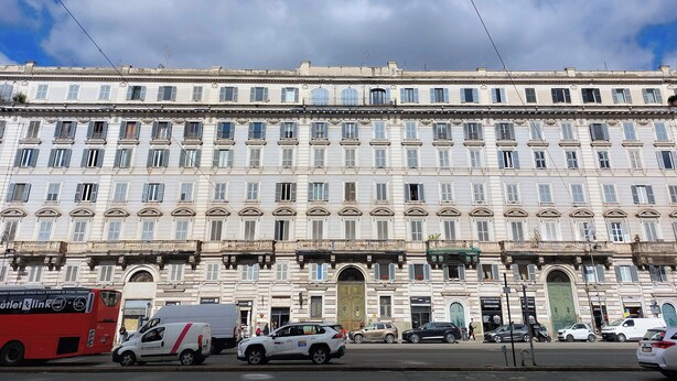 A multi-story building with a classical architectural style, featuring a symmetrical facade with evenly spaced windows and decorative moldings. - 2BR 2BA Historic Center, Metro - Comfort, Quiet (Rome)